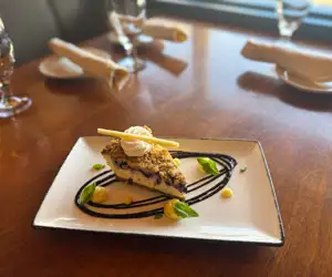 Blueberry Streusel Cheesecake: Served with lime curd and blueberry sauce
